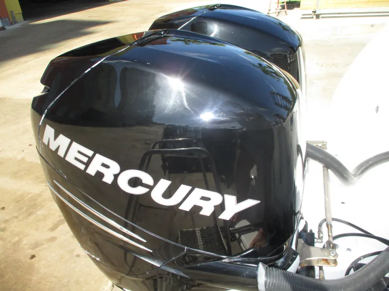 Slide: The Image of Twin Mercury outboard engines on a 2008 Pro-Line Express boat. - 10