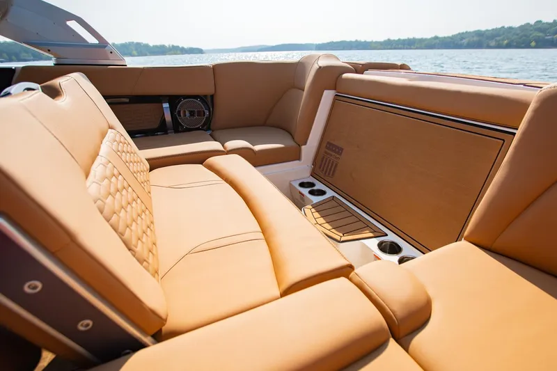 Slide: The Image of Luxurious interior of 2021 MasterCraft X22 boat with tan leather seating. - 18