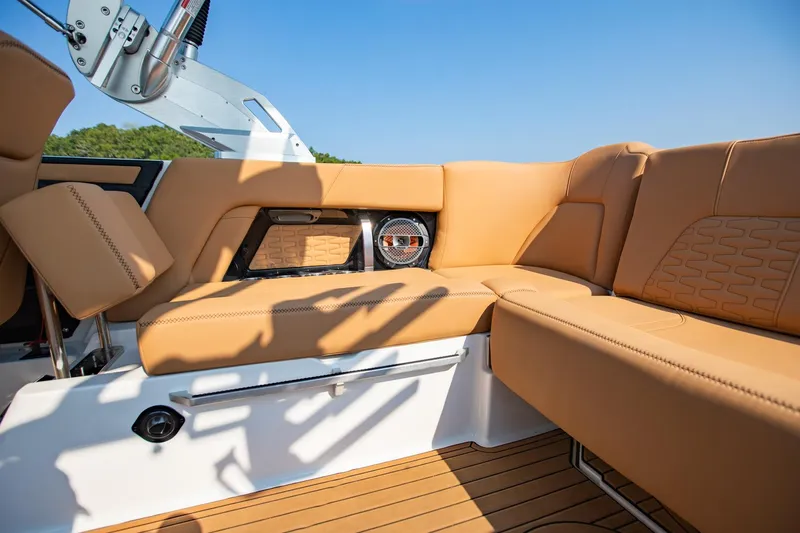 Slide: The Image of Luxurious tan seating on 2021 MasterCraft X22 boat, featuring sleek design and premium materials. - 20
