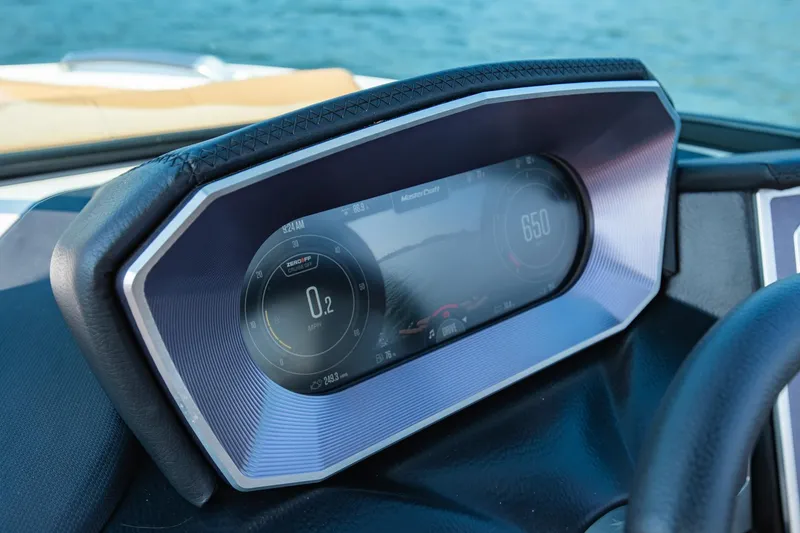 Slide: The Image of Dashboard of 2021 MasterCraft X22 boat with digital display, showing speed and controls. - 22