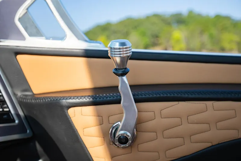 Slide: The Image of MasterCraft X22 2021 interior detail with stylish gear lever and tan upholstery. - 24