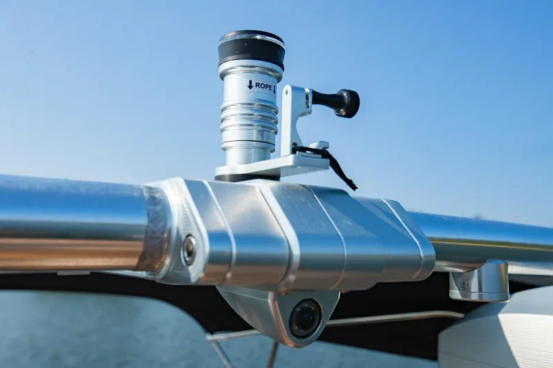 Slide: The Image of Close-up of a 2021 MasterCraft X22 boat's polished metal tower with a mounted camera. - 27