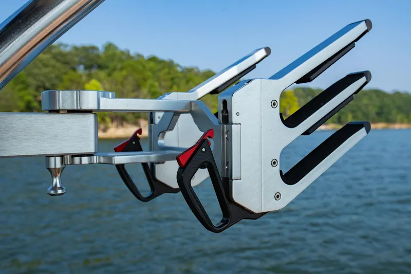 Slide: The Image of 2021 MasterCraft X22 wakeboard rack on a lake with trees in the background. - 35