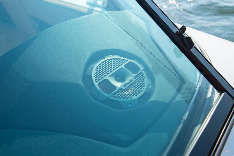 Slide: The Image of Speaker detail on 2021 MasterCraft X22 boat dashboard, near water. - 41