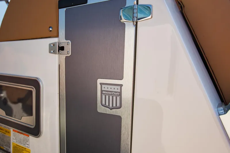 Slide: The Image of 2021 MasterCraft X22 boat detail with logo and sleek design elements. - 43