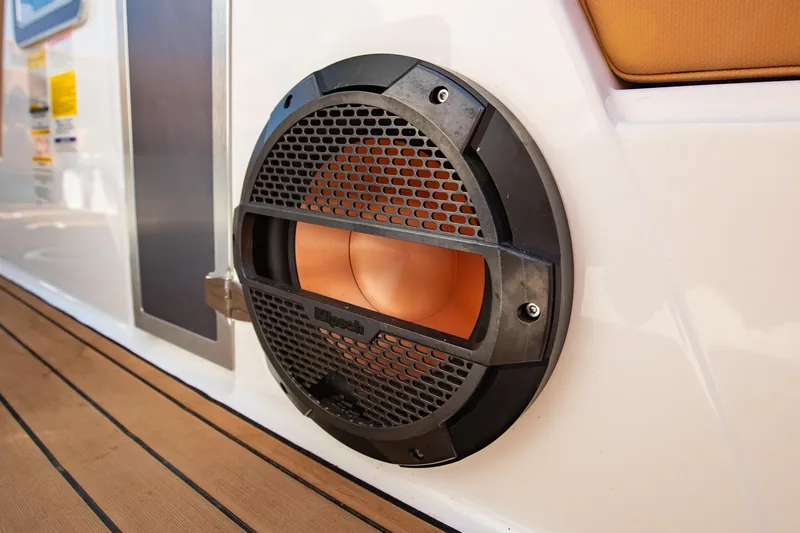 Slide: The Image of Close-up of a 2021 MasterCraft X22 boat speaker on teak deck. - 44