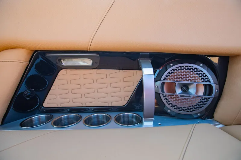 Slide: The Image of 2021 MasterCraft X22 interior detail with speaker and cup holders. - 45