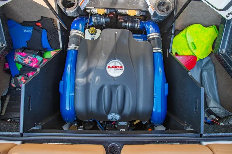 Slide: The Image of Engine compartment of a 2021 MasterCraft X22 boat with Ilmor engine and colorful gear. - 48