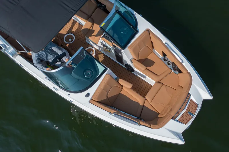 Slide: The Image of Overhead view of 2021 MasterCraft X22 boat with tan seating and sleek design. - 8