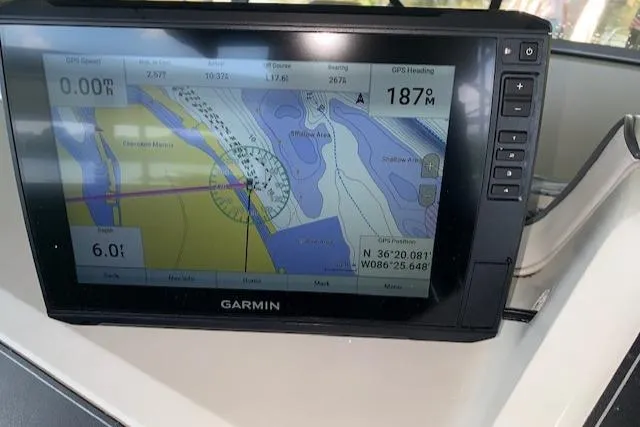 Slide: The Image of Garmin GPS display on 1995 Carver 370 Aft Cabin, showing navigation map and coordinates. - 11