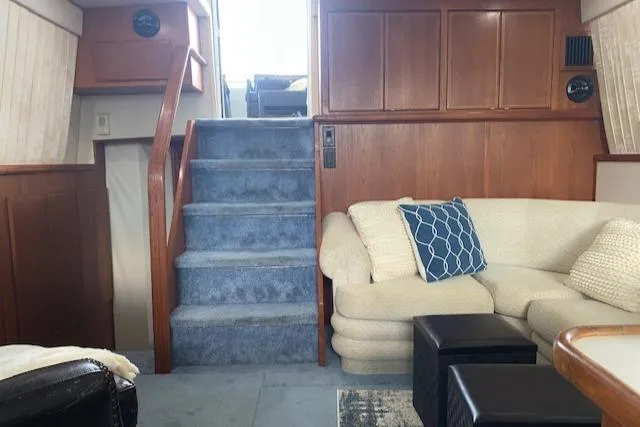 Slide: The Image of Interior of 1995 Carver 370 Aft Cabin with blue carpet and beige sofa. - 15