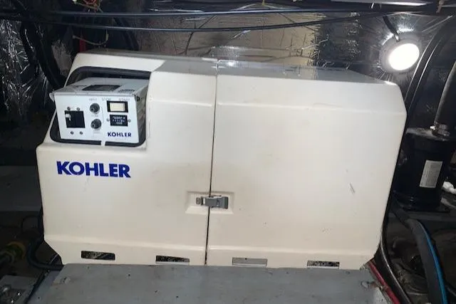 Slide: The Image of Kohler generator in a 1995 Carver 370 Aft Cabin engine room. - 25