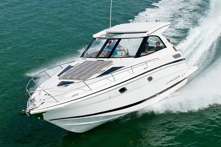 Slide: The Image of 2019 Regal 35 Sport Coupe cruising on open water. - 34