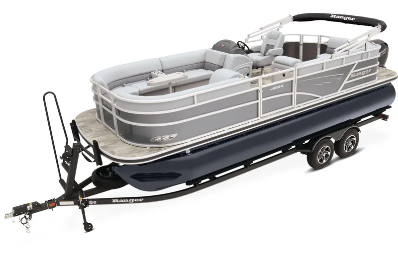 The Image of 2024 Ranger Reata 223C pontoon boat with canopy on trailer, parked outdoors. - 0