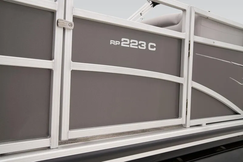 Slide: The Image of 2024 Ranger Reata 223C boat dashboard with steering wheel and control panel. - 9