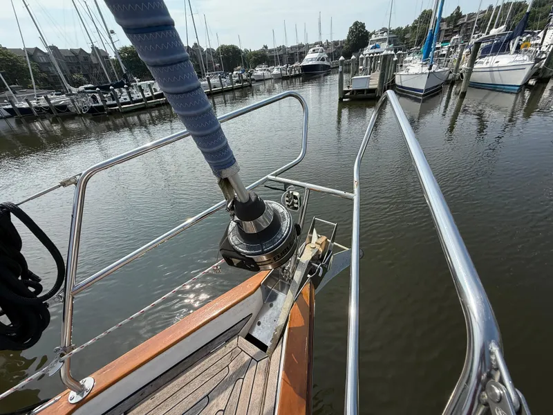 Slide: The Image of Bow of 1999 Bavaria 42 Ocean yacht docked in a marina. - 11