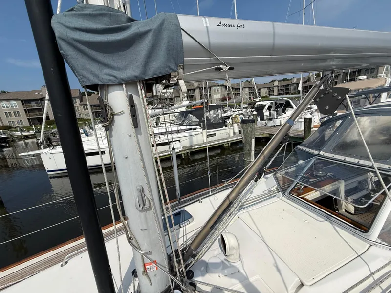 Slide: The Image of Sailboat Bavaria 42 Ocean, 1999 model, docked at marina with visible mast and rigging. - 13
