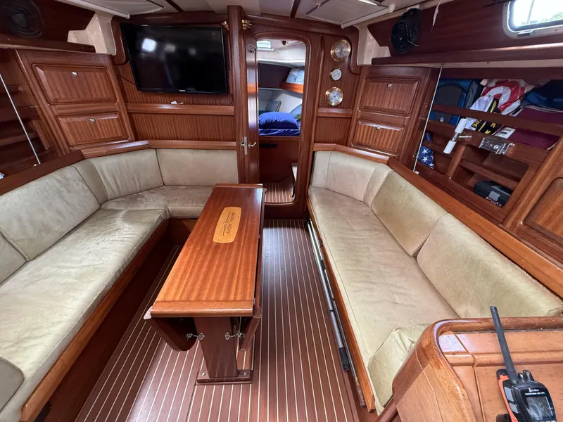Slide: The Image of Interior of 1999 Bavaria 42 Ocean yacht with wood finish and beige seating. - 20