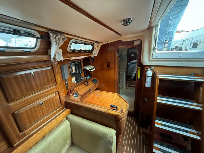 Slide: The Image of Interior of 1999 Bavaria 42 Ocean yacht with wooden cabinetry and navigation equipment. - 29