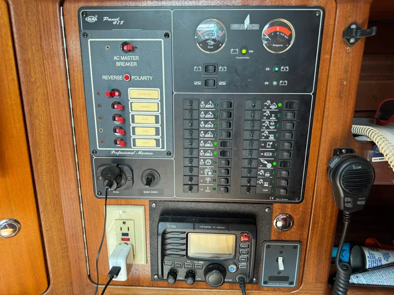 Slide: The Image of Electrical control panel on a 1999 Bavaria 42 Ocean yacht, featuring switches and gauges. - 31