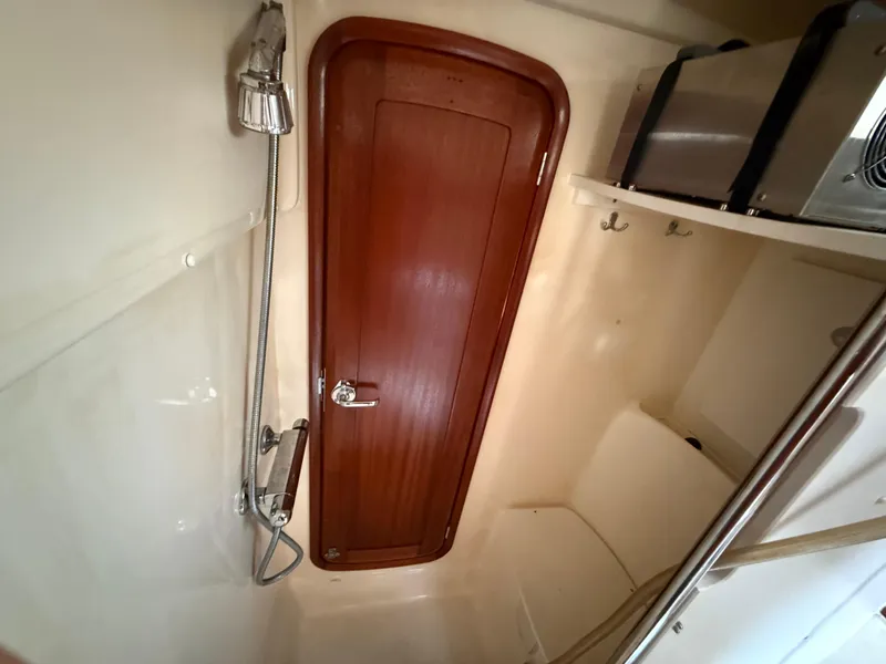 Slide: The Image of Interior of 1999 Bavaria 42 Ocean yacht bathroom with shower and wooden door. - 38