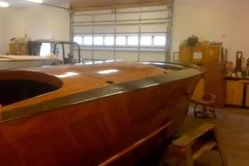 Slide: The Image of 1931 Hacker-Craft 26 Dolphin wooden boat in a garage workshop. - 109