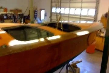 Slide: The Image of 1931 Hacker-Craft 26 Dolphin boat in a garage setting. - 115