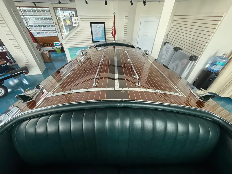 Slide: The Image of 1931 Hacker-Craft 26 Dolphin boat with polished wood finish and green leather interior. - 13