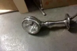 Slide: The Image of Vintage 1931 Hacker-Craft 26 Dolphin boat spotlight on a concrete floor. - 132