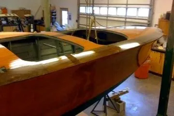 Slide: The Image of 1931 Hacker-Craft 26 Dolphin boat in a workshop setting. - 134