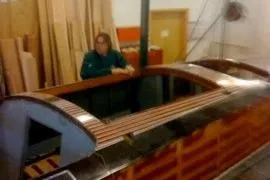 Slide: The Image of 1931 Hacker-Craft 26 Dolphin boat in workshop, wooden construction details visible. - 136