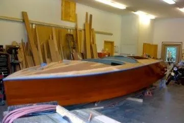 Slide: The Image of 1931 Hacker-Craft 26 Dolphin wooden boat in workshop setting. - 139