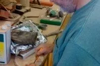 Slide: The Image of Man working on 1931 Hacker-Craft 26 Dolphin restoration project. - 144