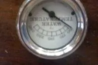 Slide: The Image of Vintage water temperature gauge from a 1931 Hacker-Craft 26 Dolphin boat. - 145