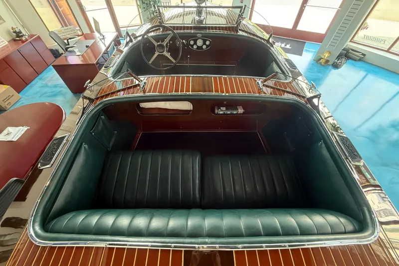 Slide: The Image of 1931 Hacker-Craft 26 Dolphin boat interior with vintage wooden and leather design. - 15