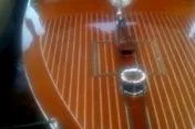 Slide: The Image of 1931 Hacker-Craft 26 Dolphin boat deck with polished wood finish and chrome details. - 152