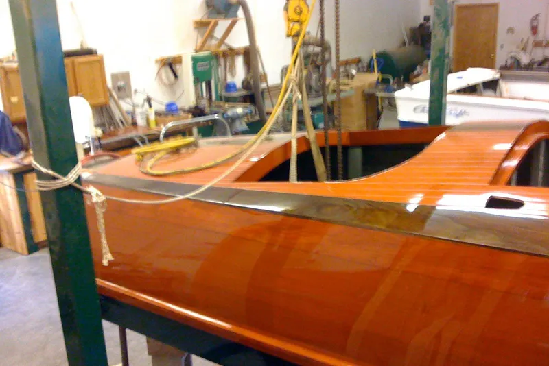 Slide: The Image of Restored 1931 Hacker-Craft 26 Dolphin boat in workshop setting. - 156