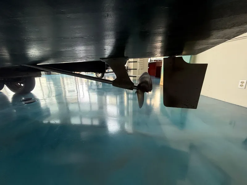 Slide: The Image of Underneath view of a 1931 Hacker-Craft 26 Dolphin boat, showcasing propeller and rudder. - 17