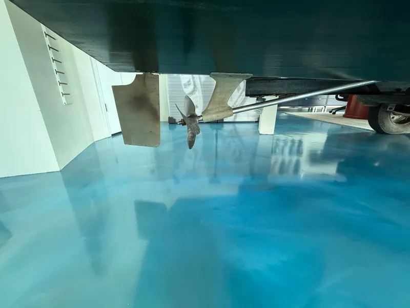 Slide: The Image of Underneath view of a 1931 Hacker-Craft 26 Dolphin boat with visible propeller and rudder. - 18