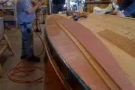 Slide: The Image of Restoration of a 1931 Hacker-Craft 26 Dolphin boat in a workshop setting. - 189