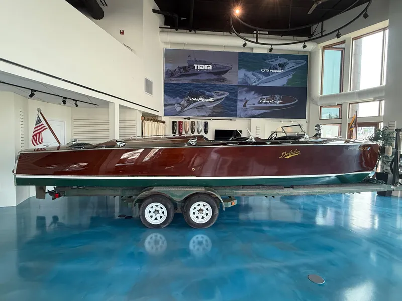 Slide: The Image of 1931 Hacker-Craft 26 Dolphin boat displayed indoors on a trailer. - 2