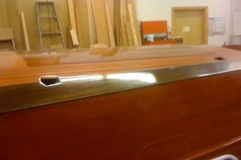 Slide: The Image of 1931 Hacker-Craft 26 Dolphin wooden boat with polished mahogany finish in workshop. - 208