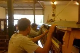 Slide: The Image of Restoration work on a 1931 Hacker-Craft 26 Dolphin boat in a workshop. - 213