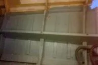 Slide: The Image of Interior view of 1931 Hacker-Craft 26 Dolphin boat, showcasing wooden structure and craftsmanship. - 215