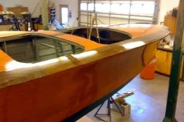 Slide: The Image of 1931 Hacker-Craft 26 Dolphin wooden boat in a garage setting. - 221