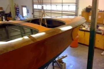 Slide: The Image of 1931 Hacker-Craft 26 Dolphin boat in a garage workshop setting. - 227