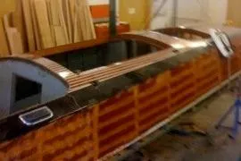 Slide: The Image of 1931 Hacker-Craft 26 Dolphin wooden boat in workshop setting. - 235
