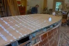 Slide: The Image of Restoration of 1931 Hacker-Craft 26 Dolphin boat in workshop setting. - 238