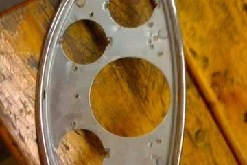 Slide: The Image of Dashboard panel of a 1931 Hacker-Craft 26 Dolphin boat on wooden surface. - 240