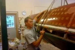 Slide: The Image of Man working on 1931 Hacker-Craft 26 Dolphin boat restoration in workshop. - 25